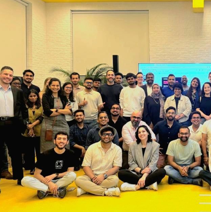 Large team group photo at an office event